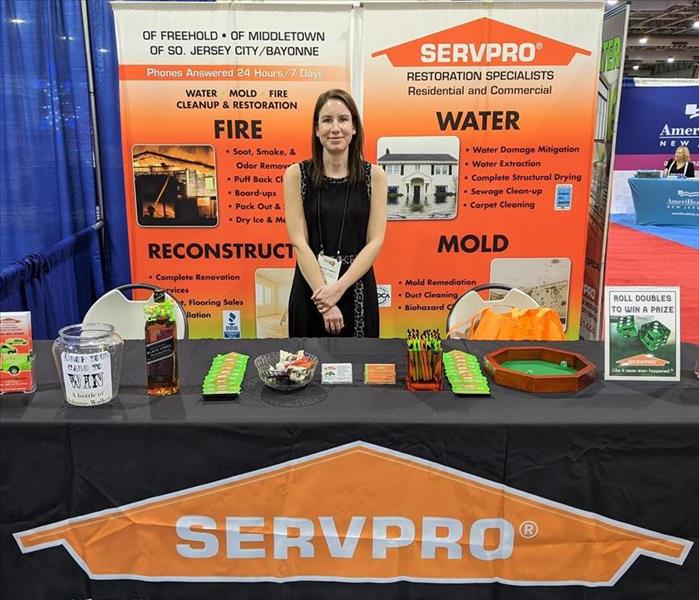 Trade show display and employee.